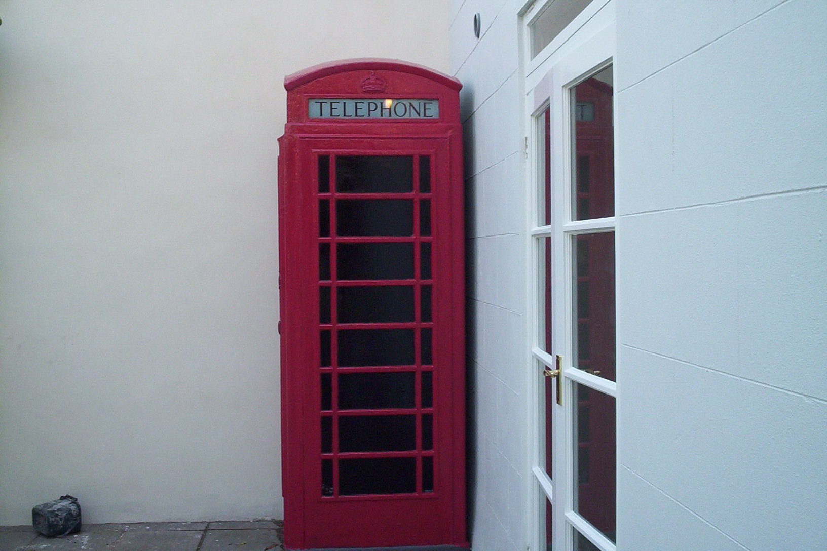 Corner view of Georgian House showing paint detail around phonebox and windows